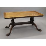 A mahogany coffee table. 94 cm long.