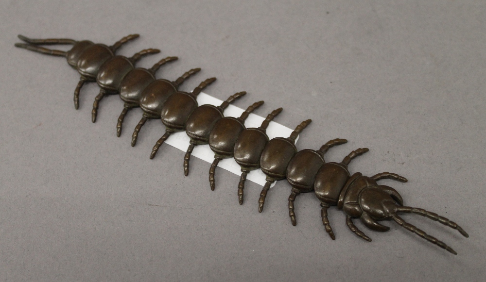 A bronze articulated centipede. 16 cm long.