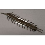 A bronze articulated centipede. 16 cm long.