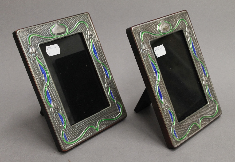 A pair of Art Nouveau style sterling silver photograph frames. Each 14.5 x 19 cm.