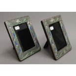 A pair of Art Nouveau style sterling silver photograph frames. Each 14.5 x 19 cm.