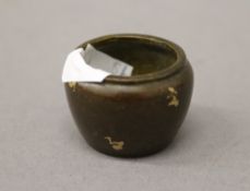 A miniature gold splash bronze censer. 2.5 cm high.