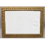 A large late 19th century gilt framed bevelled mirror. 176 x 128 cm.