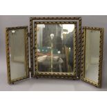 A gilt framed triptych mirror. 58.5 cm high.