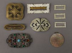 A collection of various vintage buckles