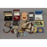 A tin of costume jewellery, etc.