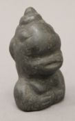 A Basalt ethnographic carved head. 10 cm high.