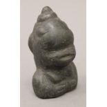 A Basalt ethnographic carved head. 10 cm high.