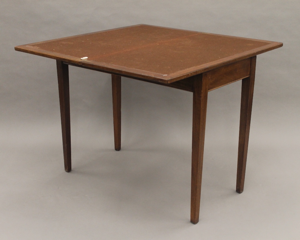 A 19th century mahogany fold over tea table. 91 cm wide. - Image 5 of 10