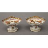 A pair of 19th century German painted porcelain salts. 6 cm high.