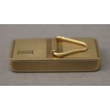 A 9 ct gold pill box. 4.25 cm long. 17.