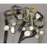 A tin of various wristwatches