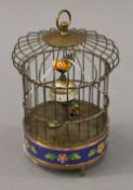 A birdcage clock. 18 cm high.