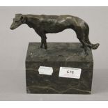 A bronze model of a greyhound on a plinth base. 15 cm high.
