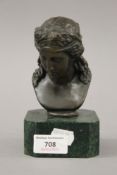 A bronze bust of a girl on a plinth base. 15.5 cm high.