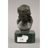 A bronze bust of a girl on a plinth base. 15.5 cm high.