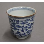 An 18th century Chinese blue and white porcelain bell shaped libation cup. 8 cm high.