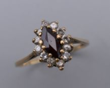 A 9 ct gold garnet set ring.