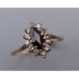 A 9 ct gold garnet set ring.