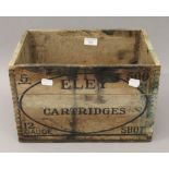 An Eley wooden cartridge box. 35 cm wide.