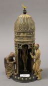 A cold painted bronze tower. 30.5 cm high.