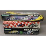 Two large boxed Scalextric and another boxed racing set.