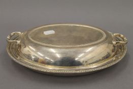 A silver entree dish. 28 cm wide. 31.2 troy ounces.