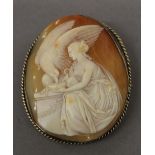 A Victorian carved cameo brooch, with silver gilt surround. 5.5 cm high.