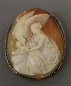 A Victorian carved cameo brooch, with silver gilt surround. 5.5 cm high.