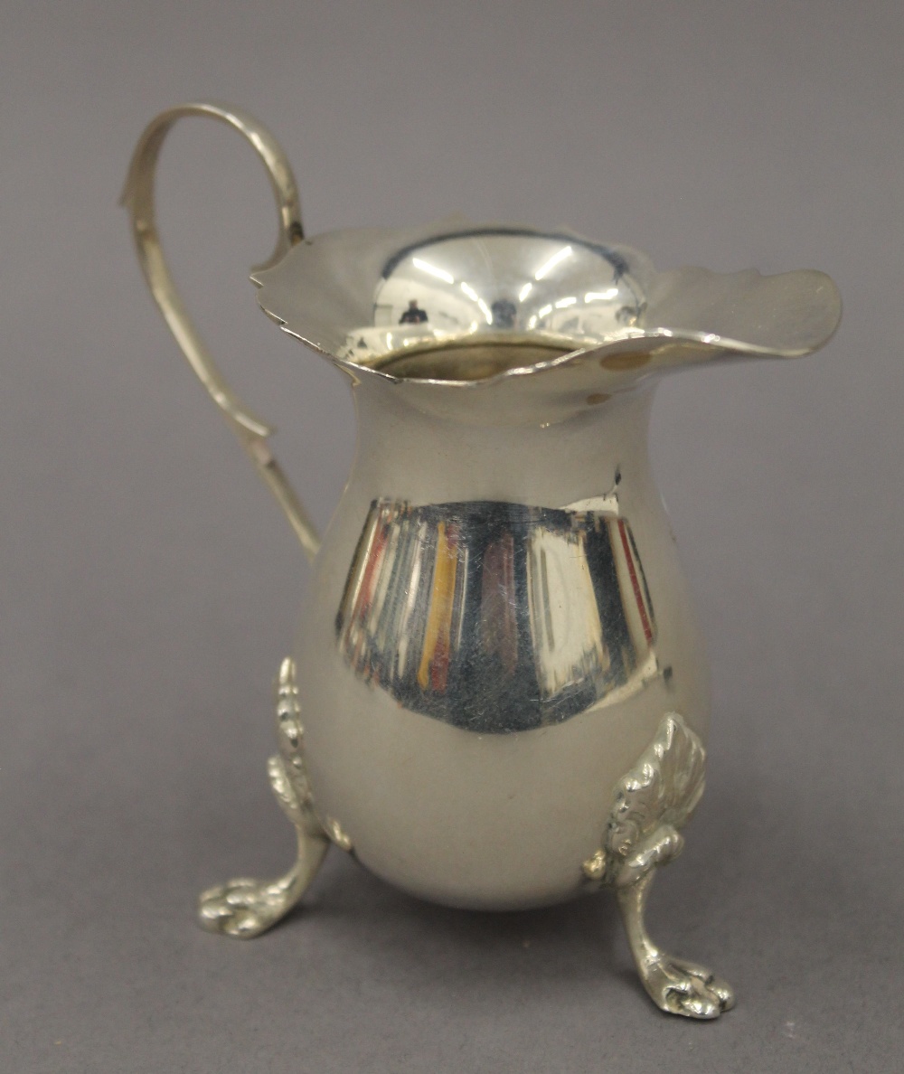 A silver cream jug. 8.5 cm high. 2.8 troy ounces.