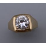 A 9 ct gold gentleman's stone set ring. Ring Size M. 3.4 grammes total weight.
