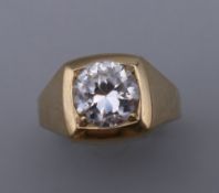 A 9 ct gold gentleman's stone set ring. Ring Size M. 3.4 grammes total weight.