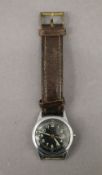 A WWII Waltham military watch. 3 cm wide.