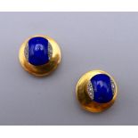 A pair of diamond set dress studs in an Asprey case.