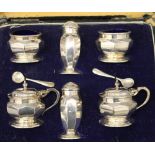 A cased silver cruet set. The case 24.5 cm wide. 8.1 troy ounces.