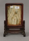 A Chinese hardwood and marble table screen. 28 cm high.