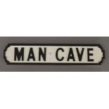 A Man Cave wooden sign. 64 cm long.