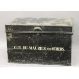 A tin deed trunk, inscribed Guy Du Maurier and others. 67 cm wide.