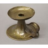 An Arts and Crafts brass chamberstick,