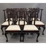A set of ten 19th century style dining chairs, including two carvers. Each carver is 69 cm wide.