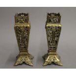 A pair of Victorian pierced brass vases. 21.5 cm high.