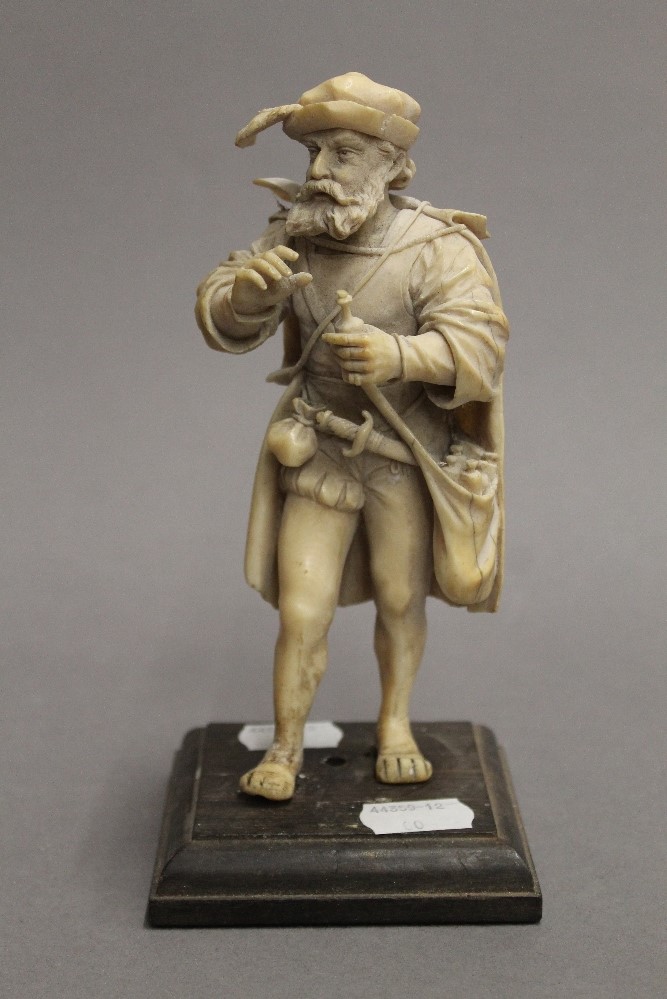 A 19th century carved ivory figure of a 17th century bearded gentleman. 18 cm high.