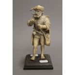 A 19th century carved ivory figure of a 17th century bearded gentleman. 18 cm high.