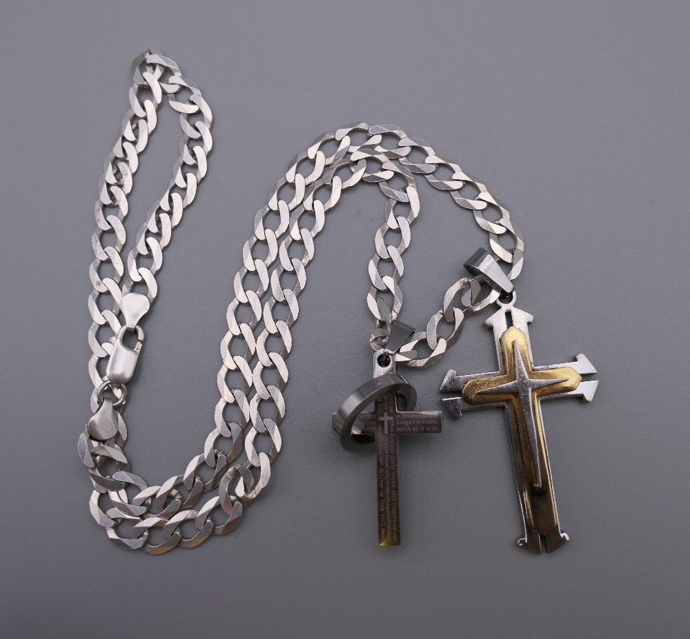A gentleman's heavy silver chain with two crosses. 55 cm long. 43.1 grammes.