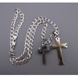 A gentleman's heavy silver chain with two crosses. 55 cm long. 43.1 grammes.