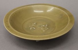 A Chinese Song Celadon twin fish marriage bowl. 21.5 cm diameter.