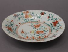 A late 17th/early 18th century Japanese porcelain Kakiemon plate. 22.5 cm diameter.