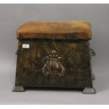 A leather topped beaten copper coal scuttle. 48 cm wide.