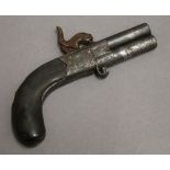 A percussion twin barrel turn over pistol. 16 cm long.