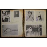 An album containing various signed photographs of mid-20th century actresses and pin ups,
